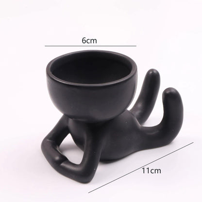 Cache-pot Céramique – Petit Personnage Assis pour Plantes Succulentes